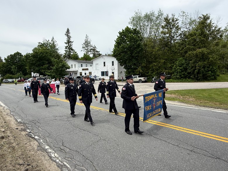 The Temple Volunteer Fire Department marches down Route 45 on Sunday as part of Temple's Memorial Day service. 