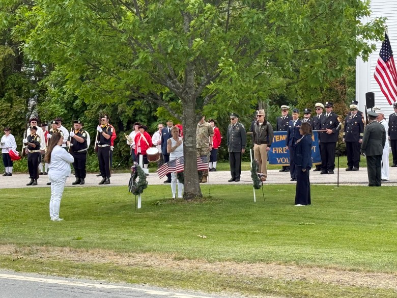 Wreaths are presented at the town's memorial tree in honor of Temple sons killed in battle. 
