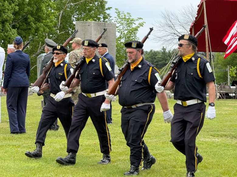 The American Legion Post 13 rifle squad from Greenville marches in the Temple parade on Sunday.