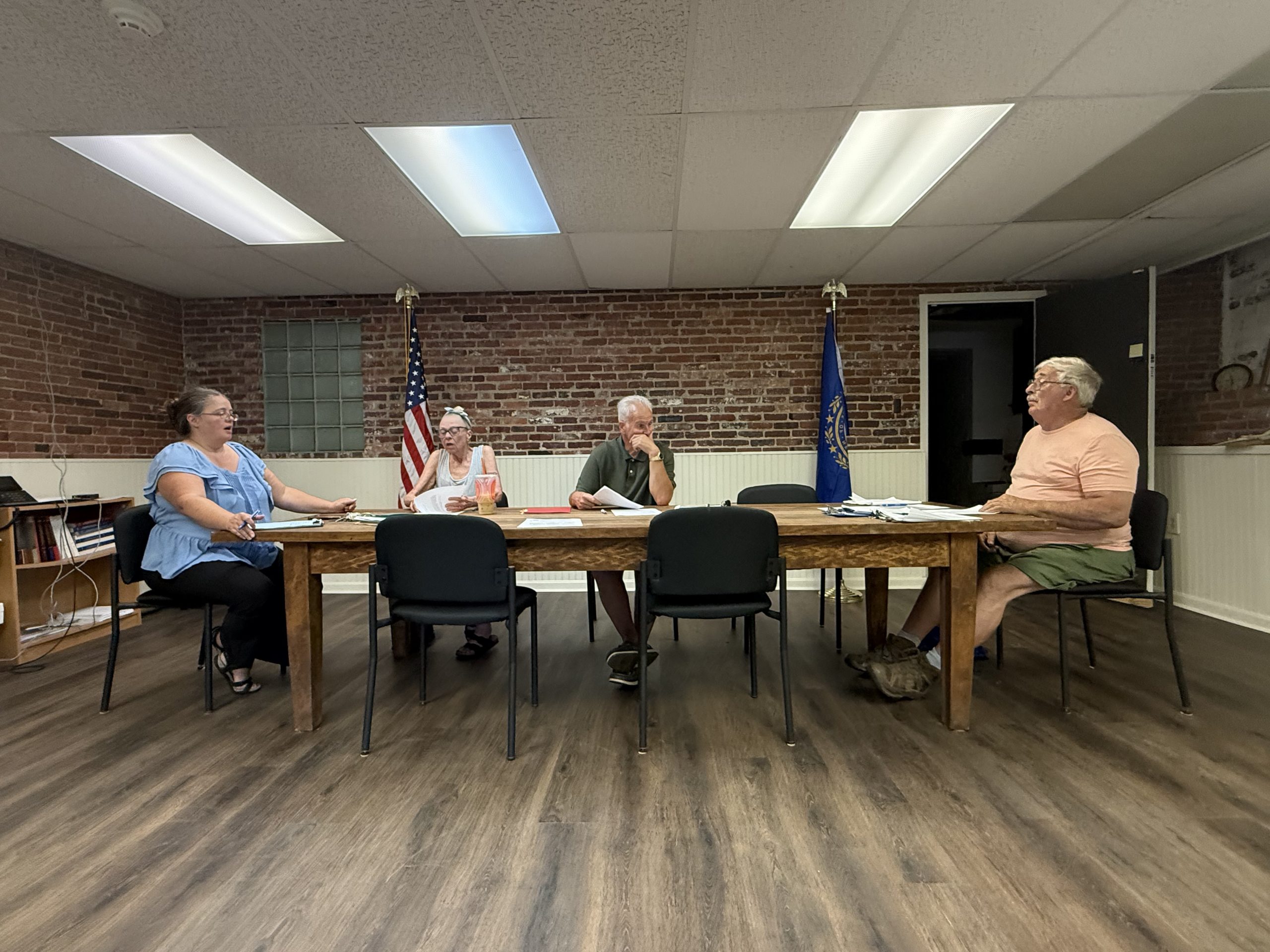 Town Administrator Tara Sousa, and Select Board members Katherin McNamara, Daniel Sadkowski, and Charles Buttrick discuss a proposed tax relief application.