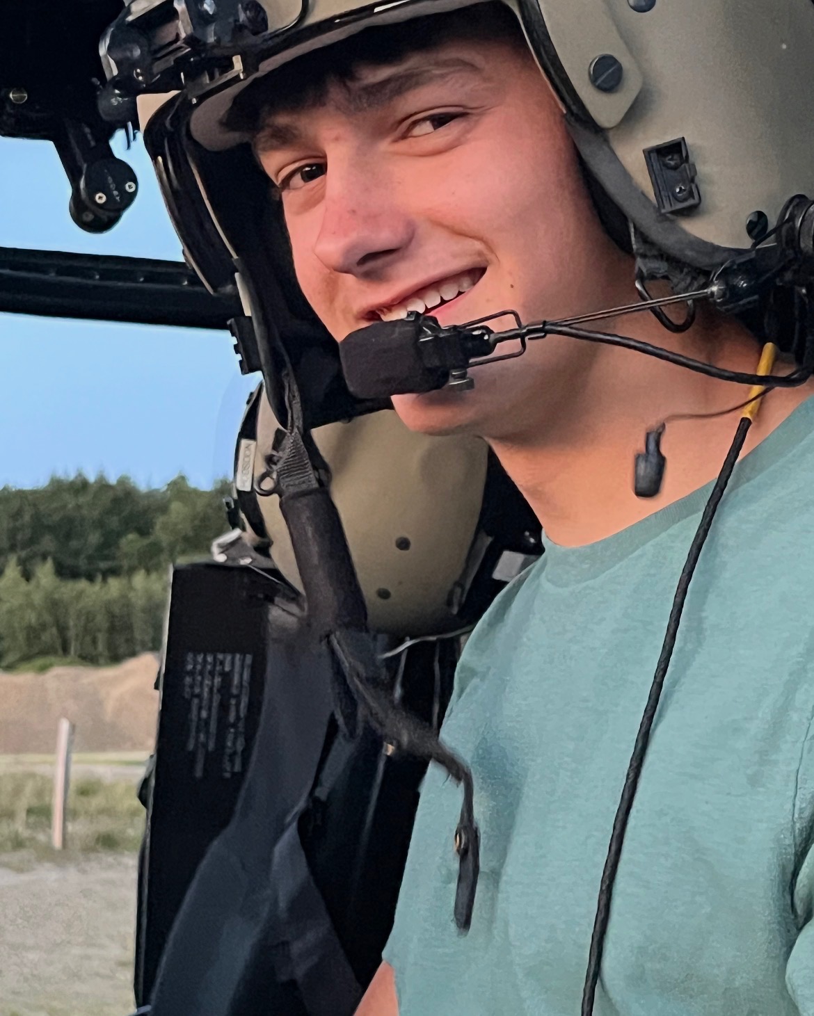 Gavin Niemela aboard a helicopter.