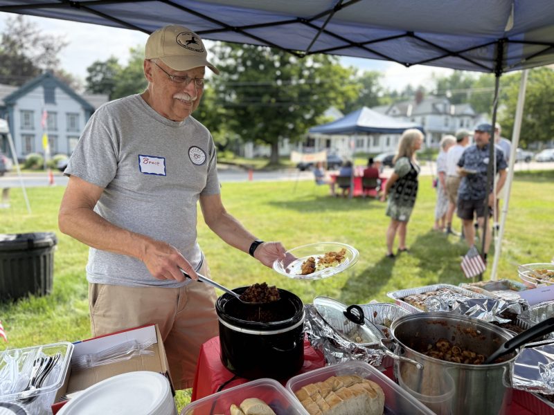 Bruce Hill fills his plate.
