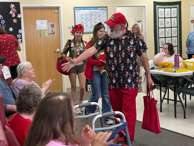 John Stone as Monadnock Santa greets the clients of the Monadnock Adult Care Center.