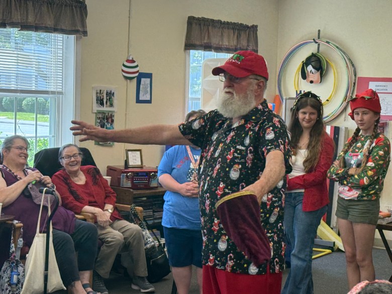 John Stone as Monadnock Santa performs tricks and jokes.