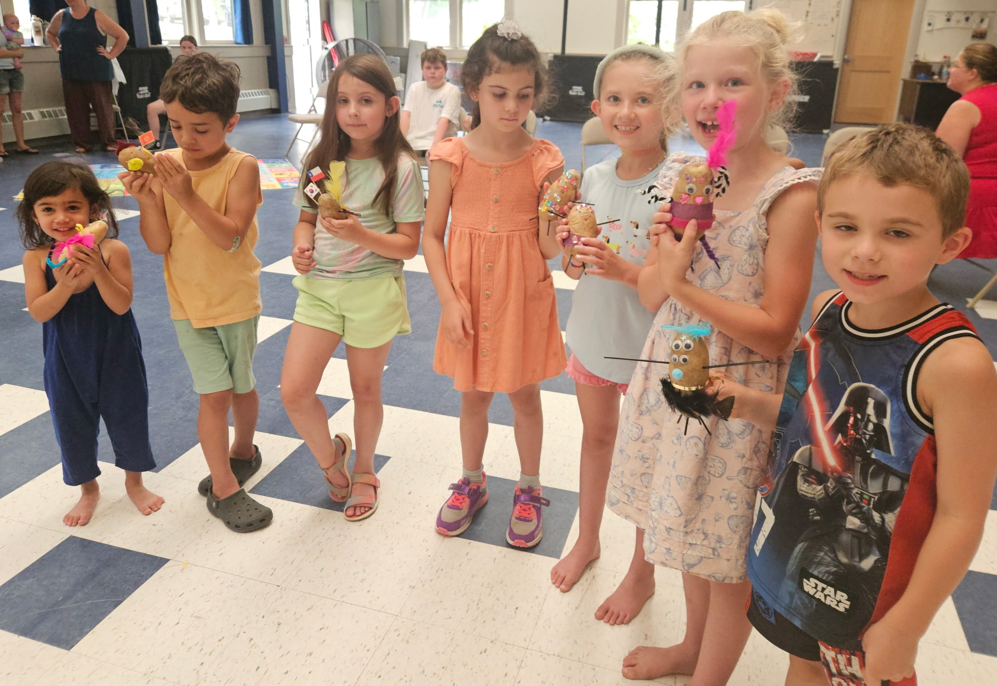 Zoe Tabuyo, Harrison Manning, Penelope Dube, Annabelle Zappotik, Bella Hoffman, Salem Landry, and Brantley Hoffman show off their "potato people."