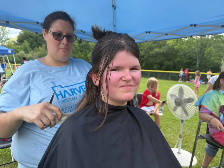 Jenni Demont gives a free haircut to Darcy Taylor, 16, of Antrim.
