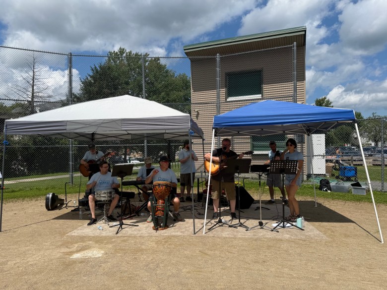 The Harvest Fellowship band plays live music for the event.