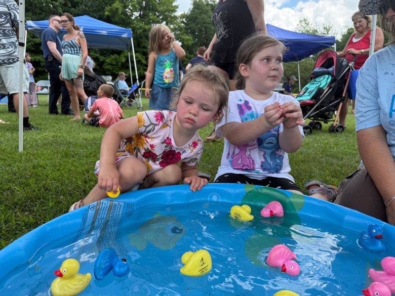 Elovie Robichaud 2, and Lilliana Marshall, 6, of Fitzwilliam fish for ducks in the children's game area.