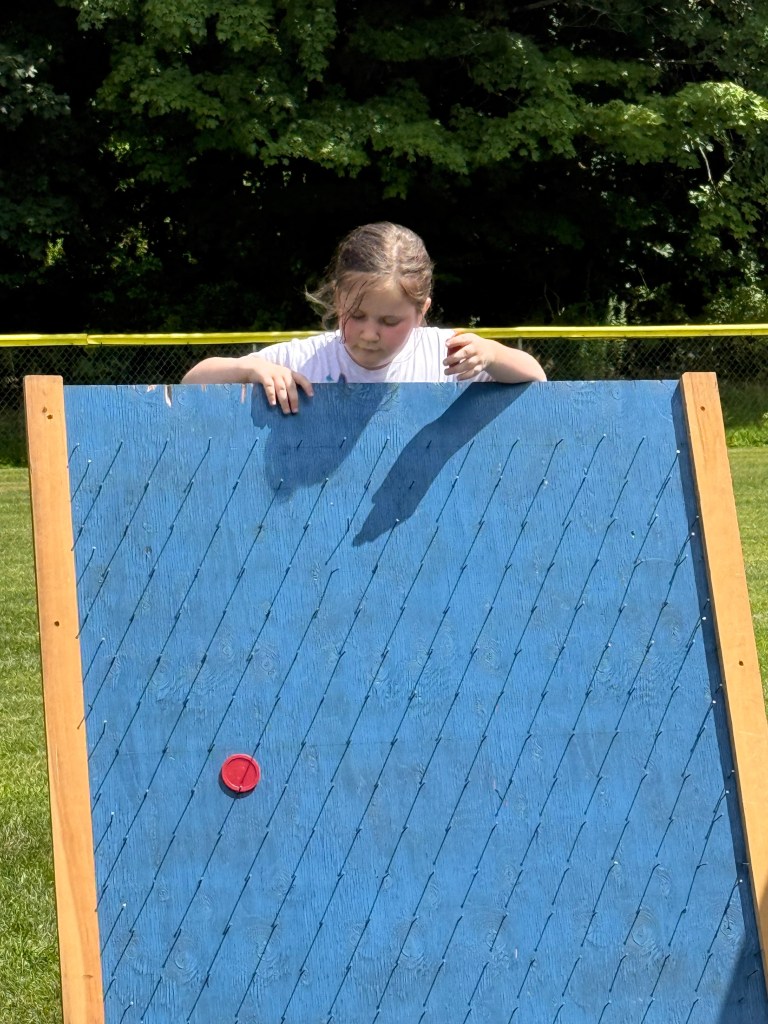 Lilliana Marshall, 6, of Fitzwilliam plays plinko.