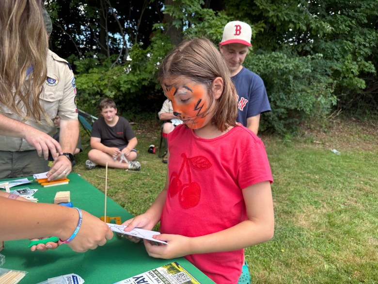 Madelynn Martel of Rindge makes a sail boat to race.