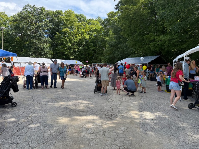 The children's game area was packed with participants.