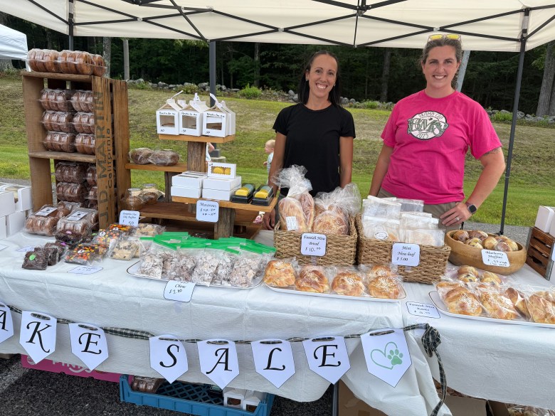 PTSO members Kelsi Somero and Brittney Brooks man the PTSO Bake Sale table.