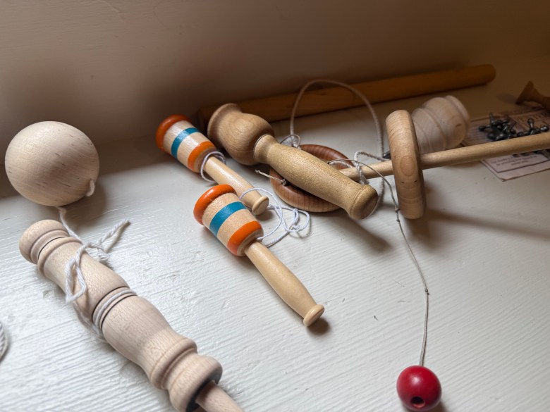 Toys, an example of some of the amusements typical of the time period, along the side benches at the Melville Academy.