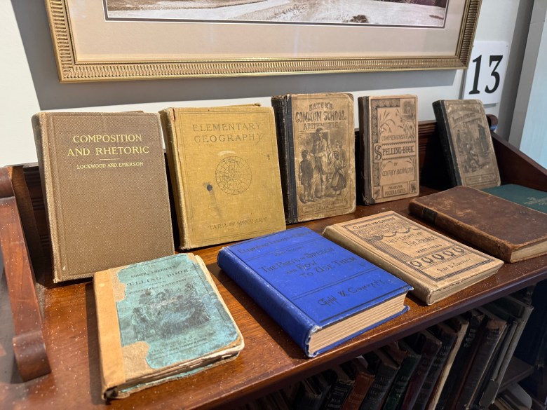 A collection of historical books from the Melville Academy library.