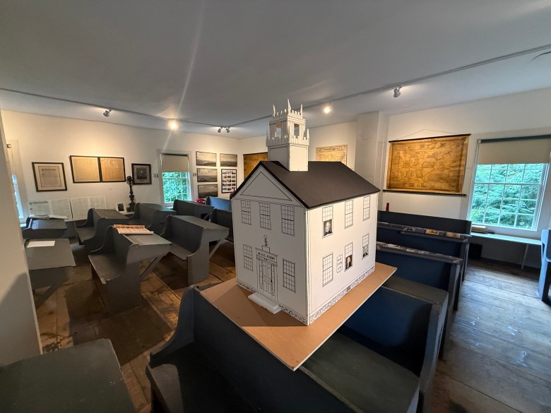 The Melville Academy's upstairs classroom, featuring a model of the building.