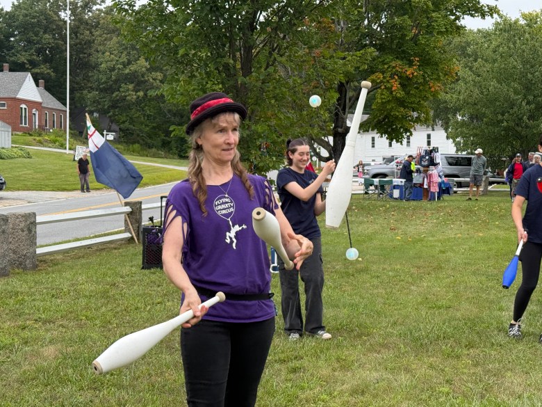 Jackie Davis of the Flying Gravity Circus juggles for children.
