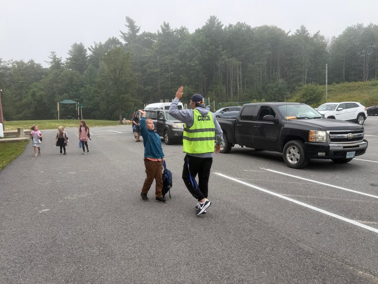 Coach Aric LeClair welcomes students to the first day of Rindge Memorial School.