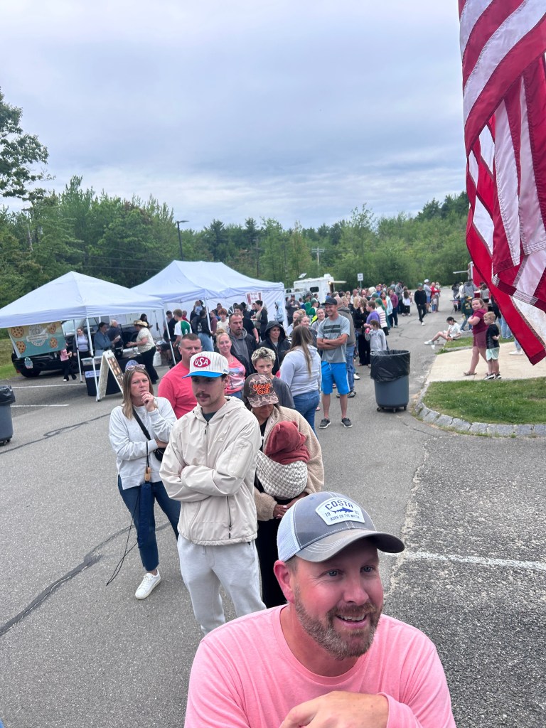 A long line forms at a Mascenic High School food truck event.