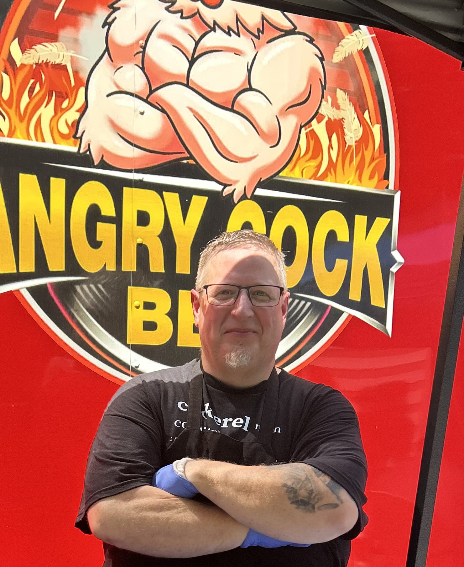 Pitmaster Ken MacInnis in front of his food truck.