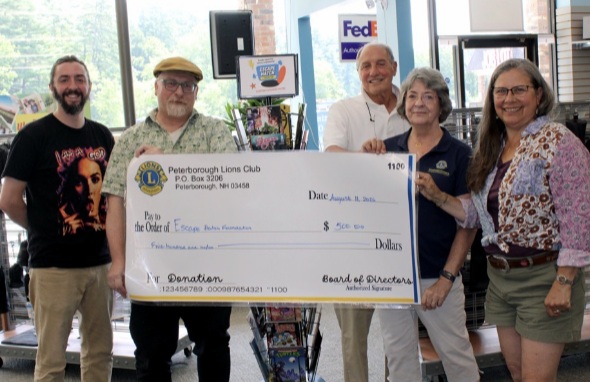 Left to right: Matt Burbridge, Escape Hatch Foundation board member, Joe Bills, co-founder and co-owner of Escape Hatch Foundation and Escape Hatch Books, Jack Nieskens, Peterborough Lions Club president, Arlene MacArthur, club secretary and Deidre McGrath-Fischer, club member.