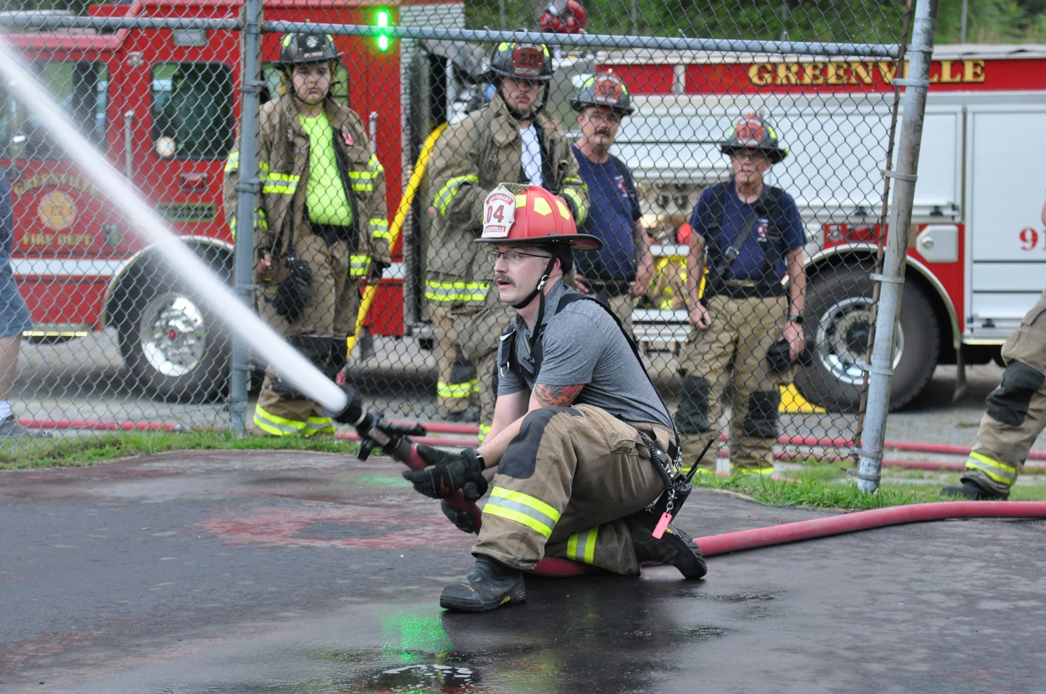Scott Jenkins trains on using the crews' fire hose.