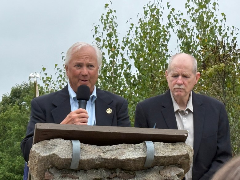 State Reps. John Hunt and Jim Qualey read a proclamation honoring Harris's lifetime of service to the town of Rindge during his funeral.
