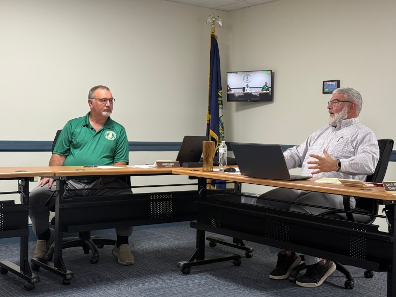Selectman Andy Lawn listens as Town Manager Jon Frederick lays out ambulance options.