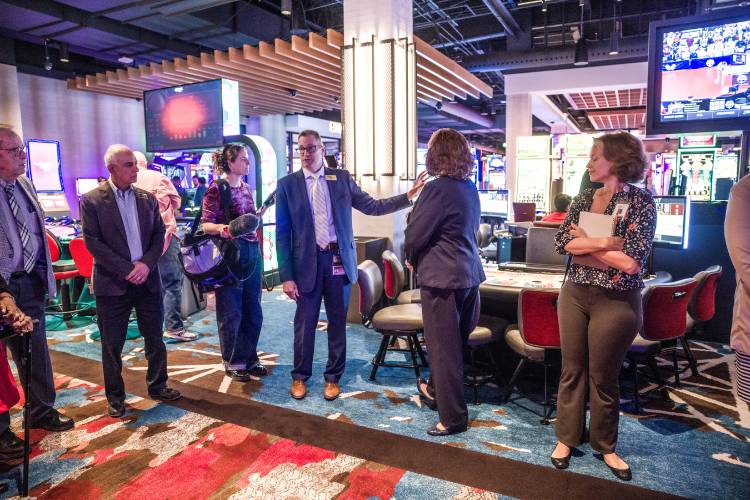 The Nash Casino general manager Eric Althaus (center) shows the main casino floor during the tour for New Hampshire representatives on Wednesday, May 7, 2025.