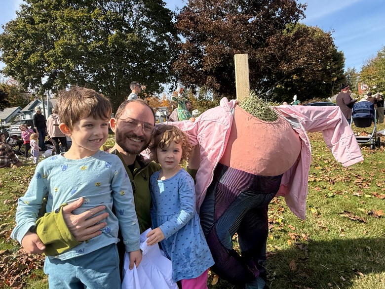 Baxter, Pascal and Io LeBoeuf with their scarecrow, in progress. 