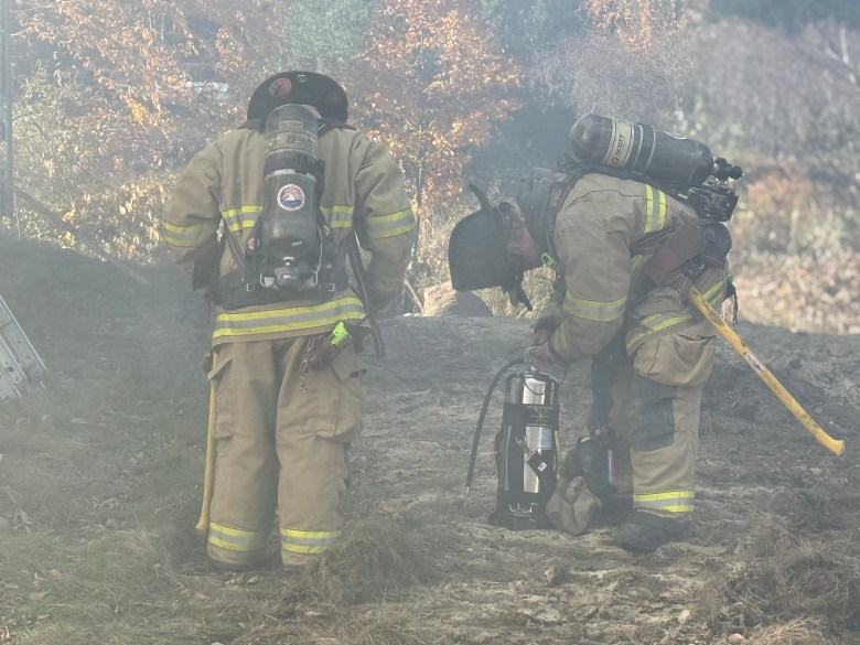Smoky conditions fill the yard as fireteams prepare to enter for training.