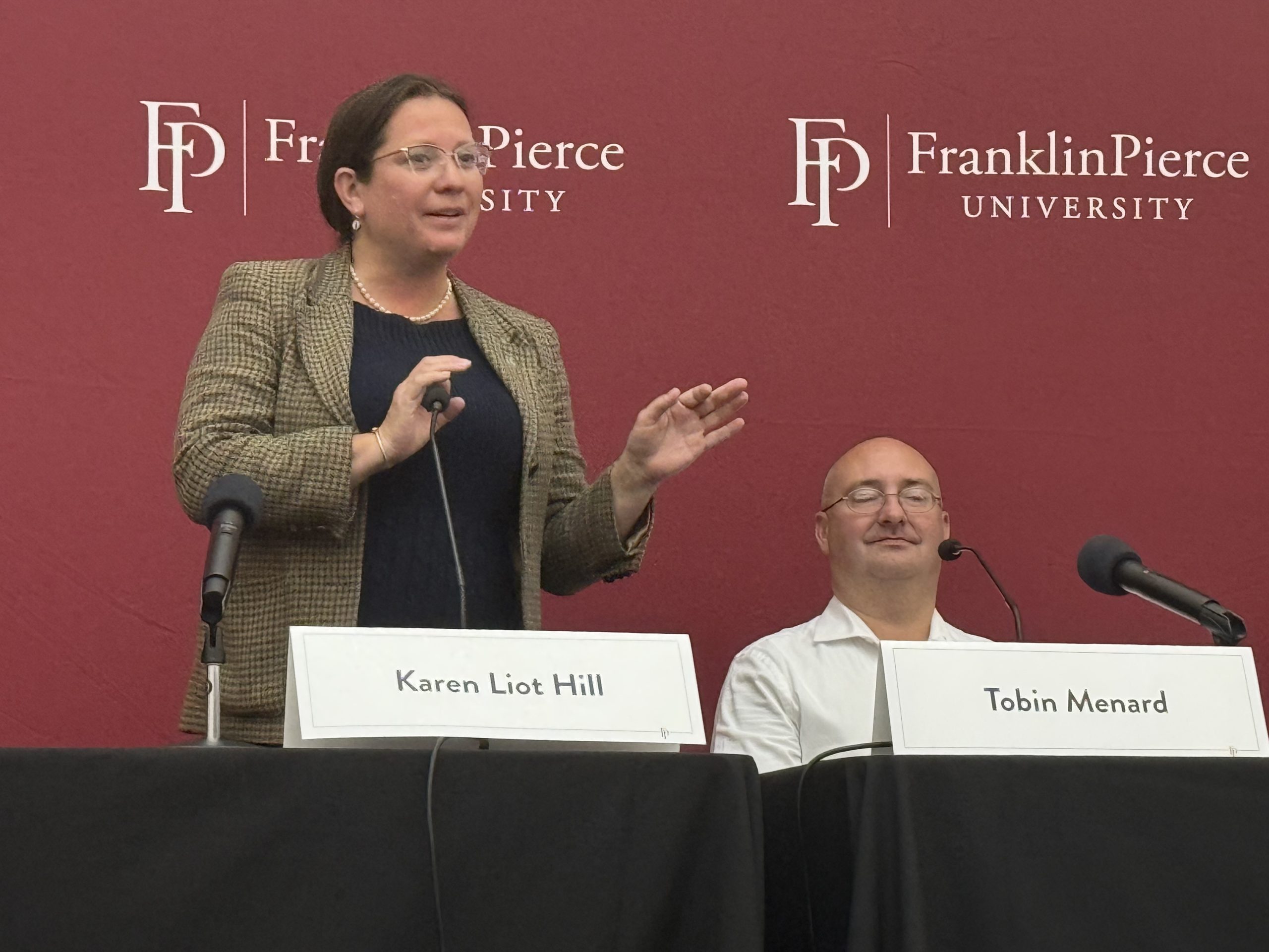 Executive Council member Karen Liot Hill introduces herself while challenger Tobin Menard looks on.