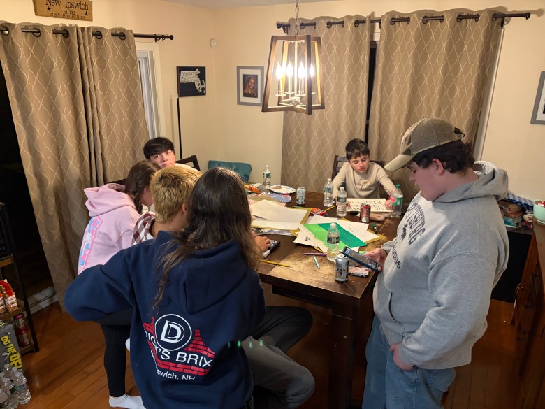 Laci Wescott, Jake Amadon, Morgan Morrill, Logan Morrill, Eliana Nicholes and Joey Ferullo gather to work on posters.