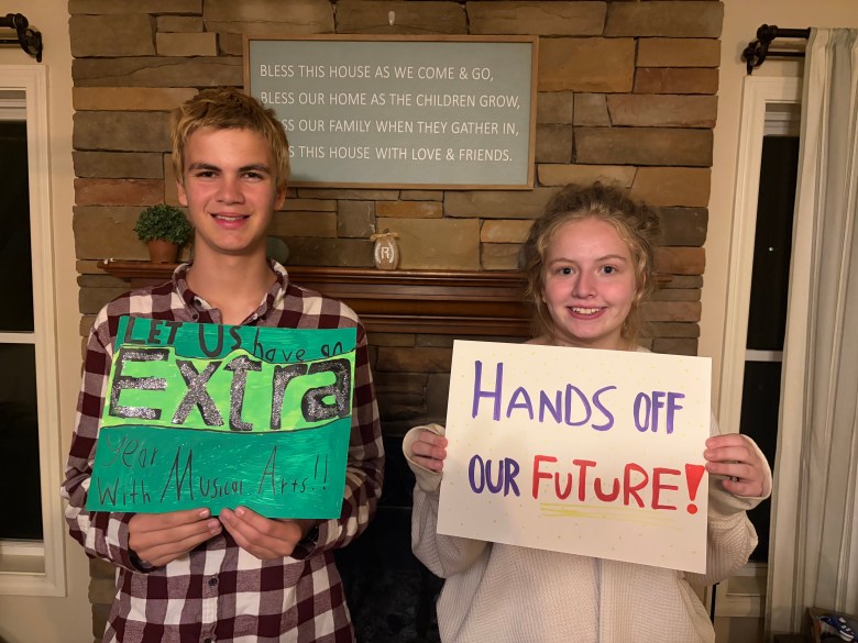 Organizers Logan Morrill and Isabell Ratliff with their protest signs, which they will bring to the polls on Nov. 3.