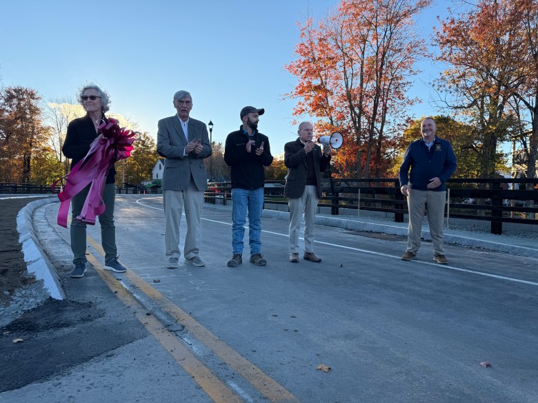 Development Projects Coordinator JoAnne Carr, Selectman Franklin Sterling, Project Manager Zachary Paight, Select Board Chair Charlie Turcotte and Selectman Andy Lawn open the new bridge. 