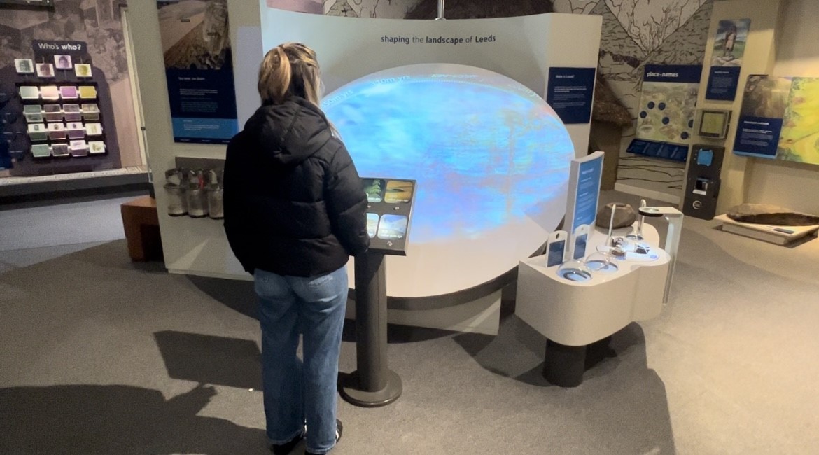 Young woman looking at at exhibit at Leeds City Museum