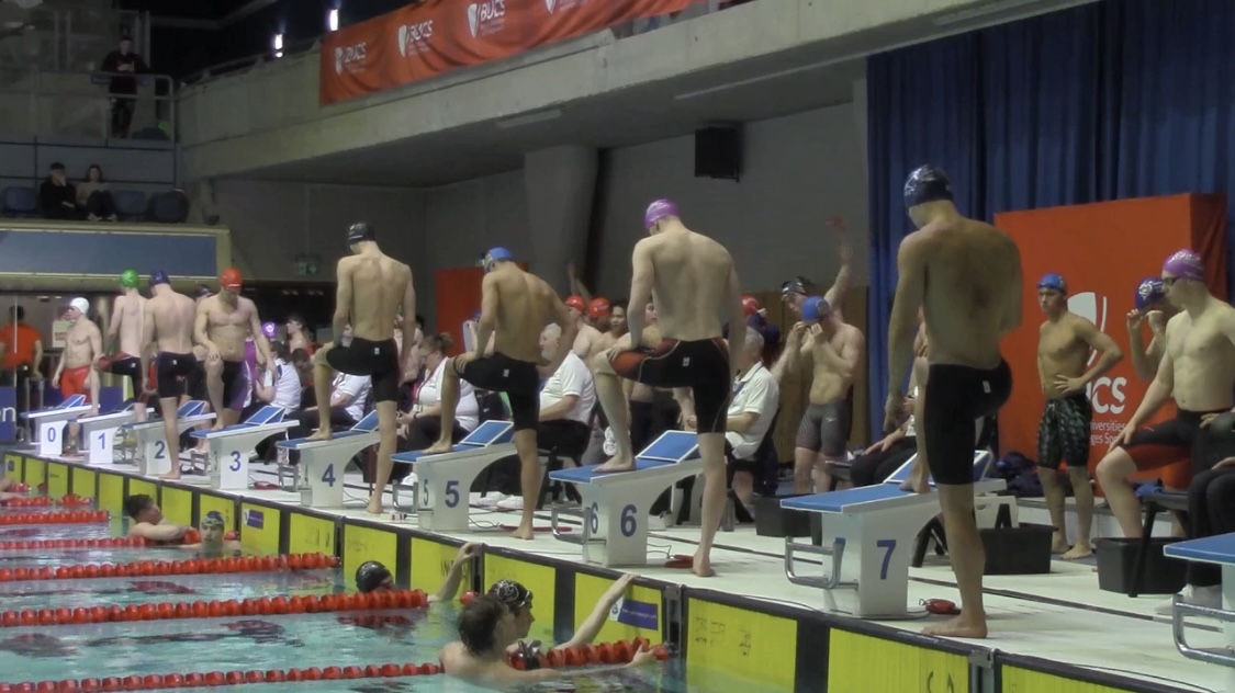 Swimmers waiting to get onto stands