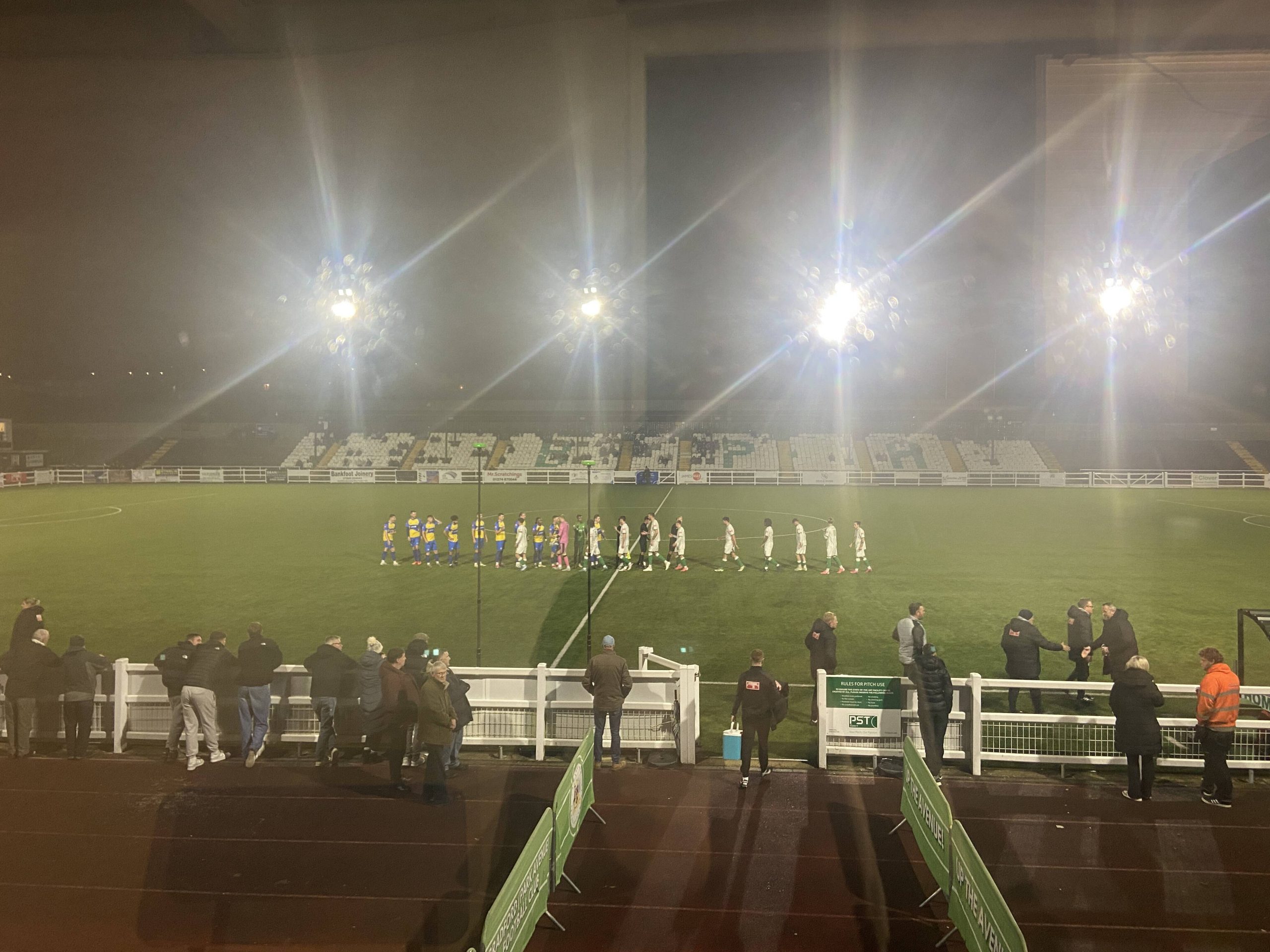 Bradford (Park Avenue) and Carlton Town players shake hands ahead of kick-off.