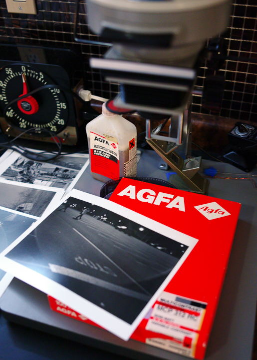 My dark room (finished basement) prints on old paper and in old developer. AGFA.