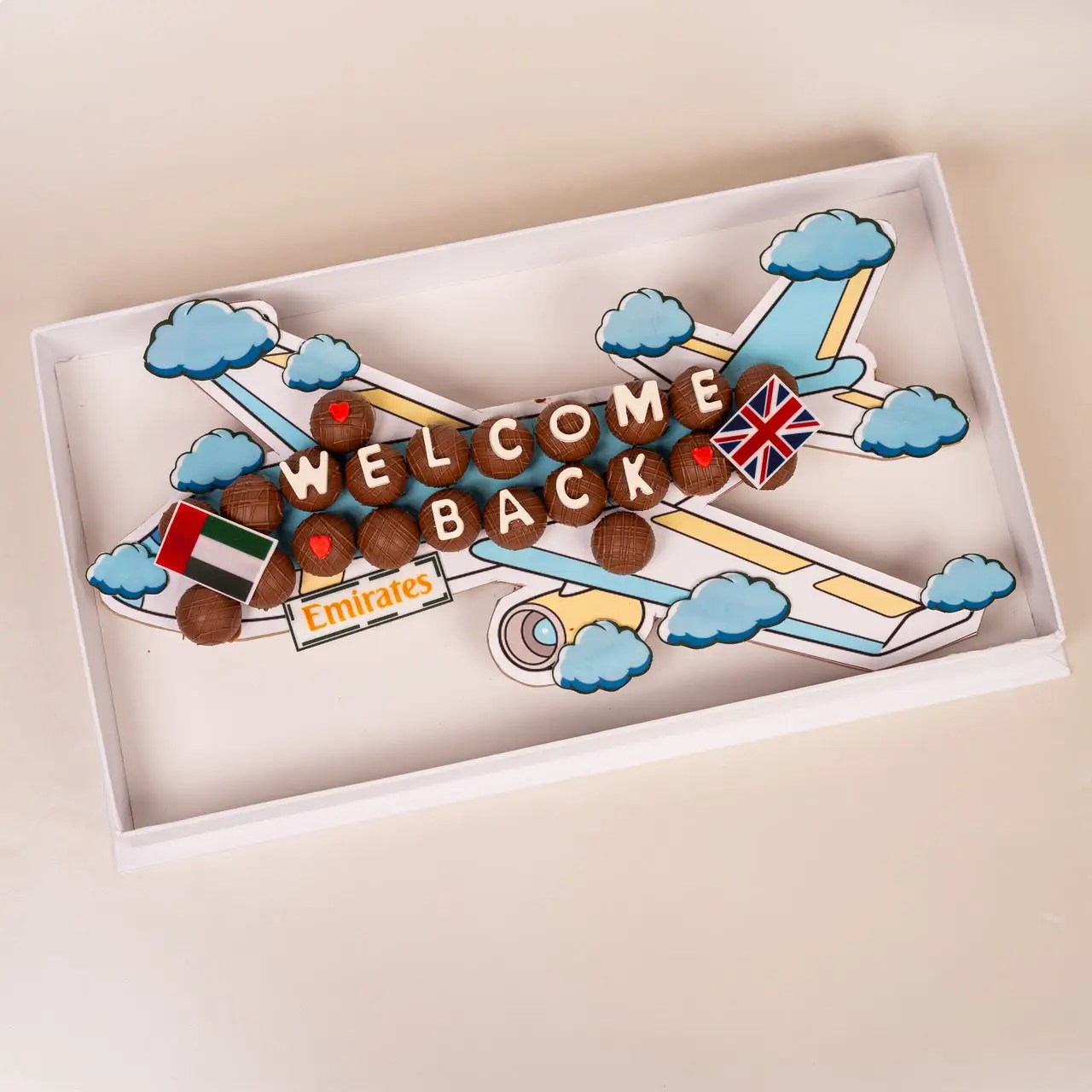 Welcome Back chocolate gift box with airplane theme and UAE and UK flags