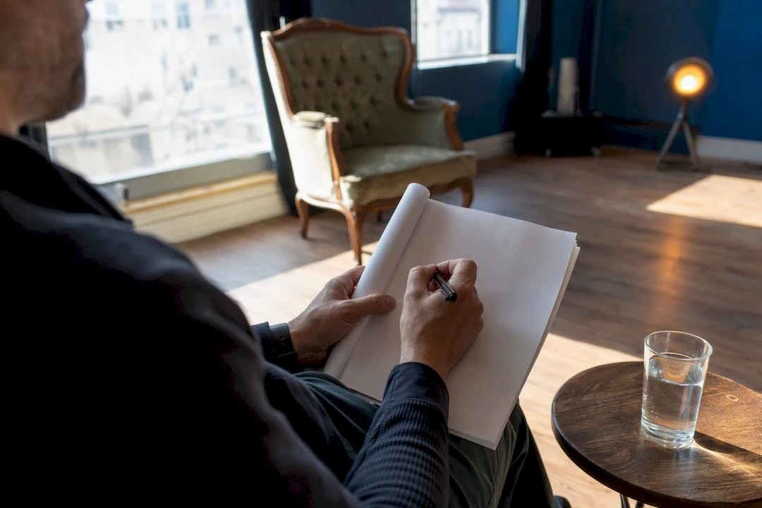 Director holding script mid-note