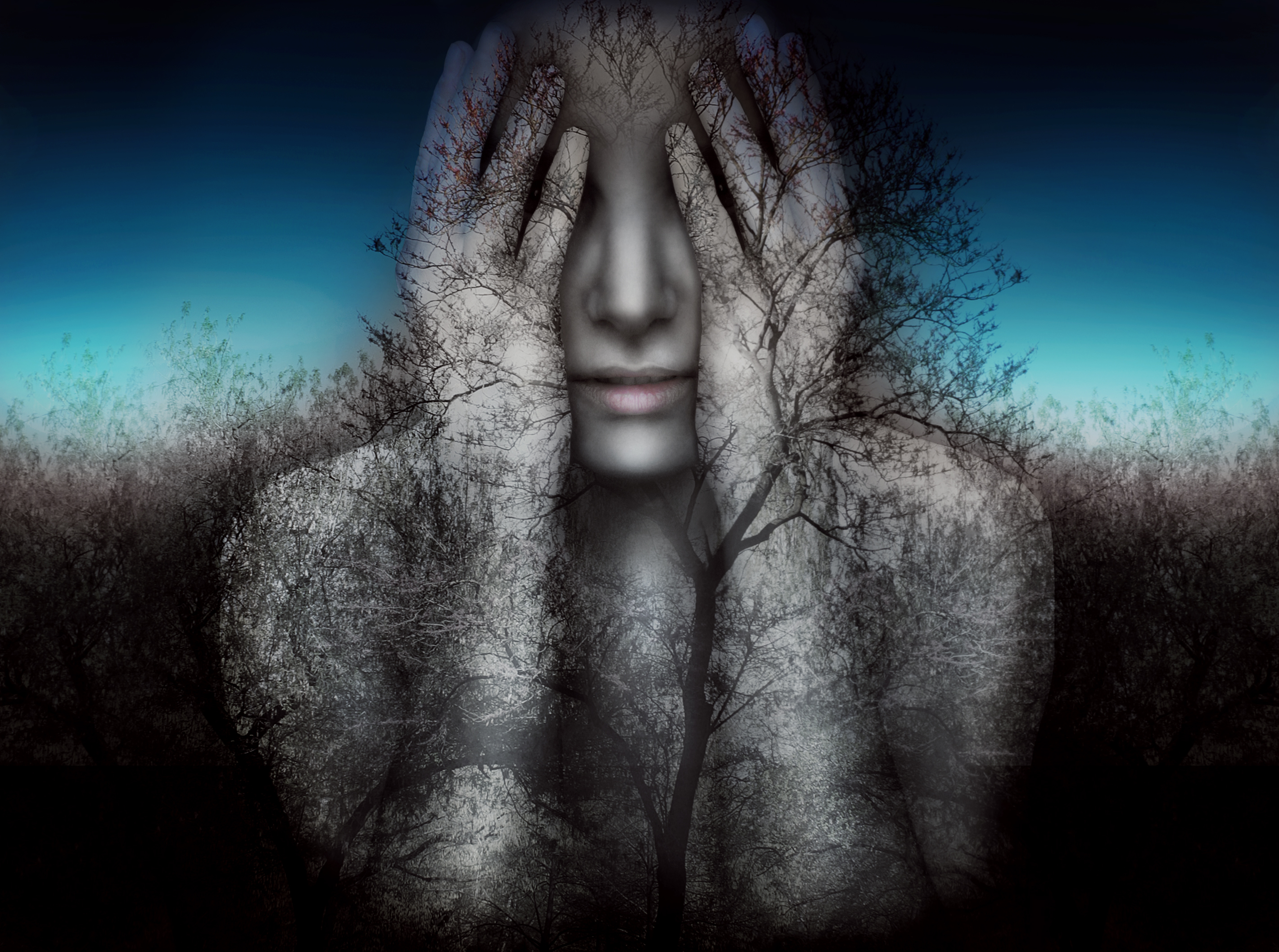 Surreal and artistic image of a girl who covers her eyes with her hands on a background of trees and sky