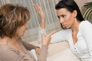 Blog. Two serious women talking. 3.13