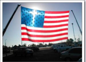 Blog. American flag with cross sun reflection.
