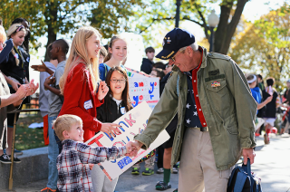 Blog. Veteran w. kids. signs.  2. 11.15