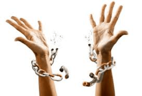 A woman’s hands reaching triumphantly skyward, breaking the chains with which she was bound
