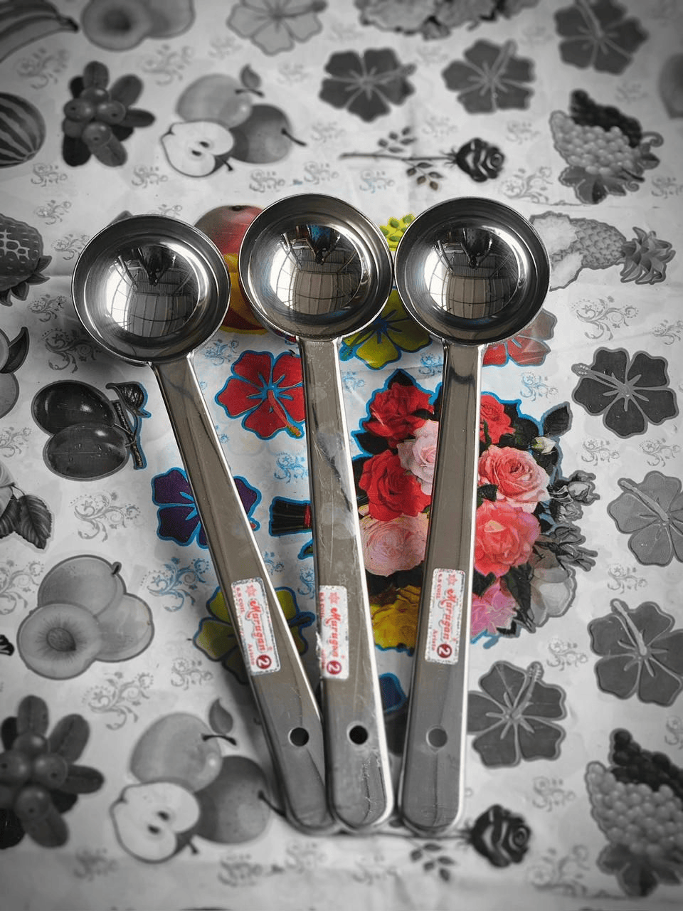 Three stainless steel serving spoons