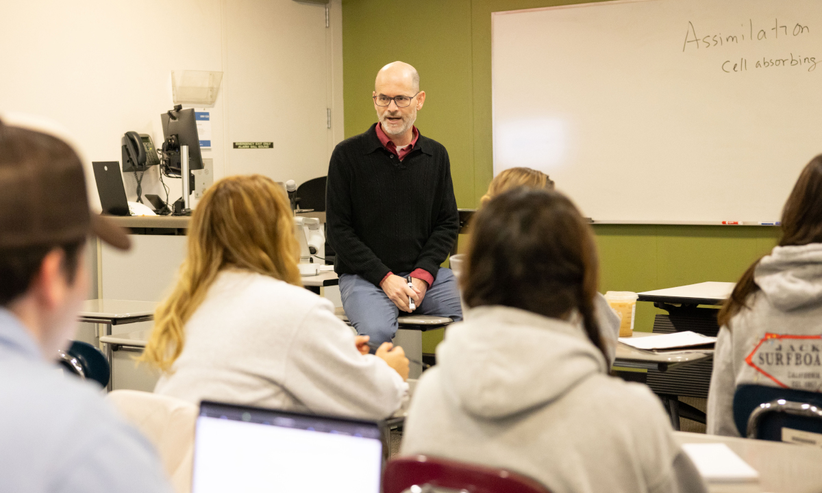 brett hoover teaching to a class of students