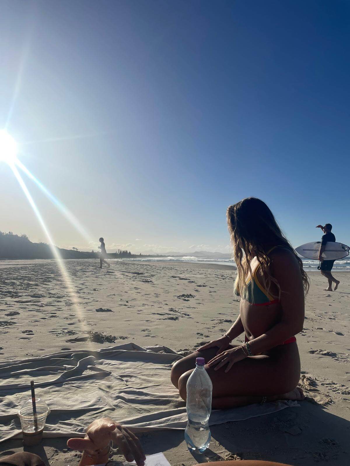 Relaxing at the beach in Byron Bay during my backpacking trip through Australia