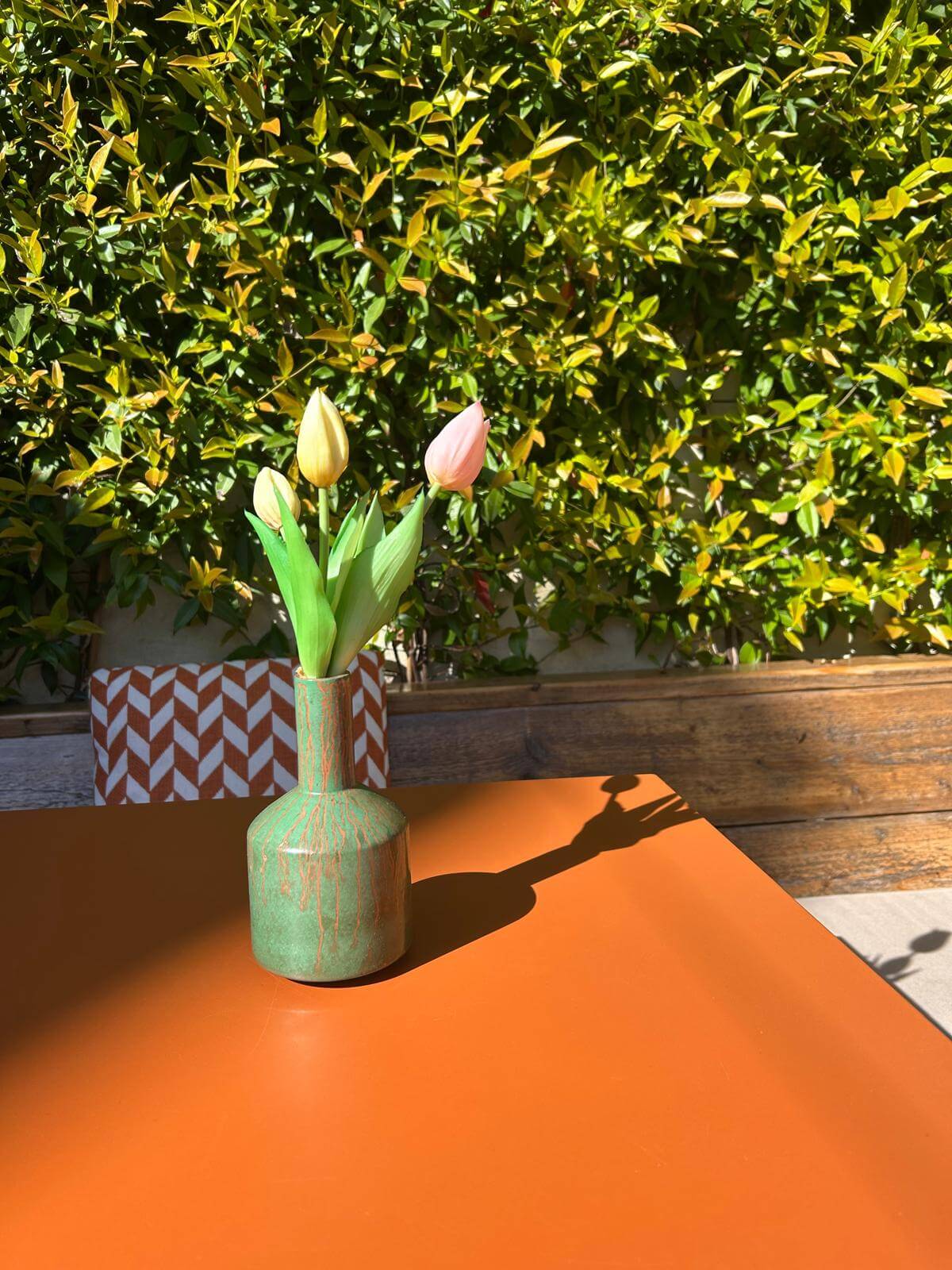 Flowers in a vase on a café terrace in Bruges, Belgium