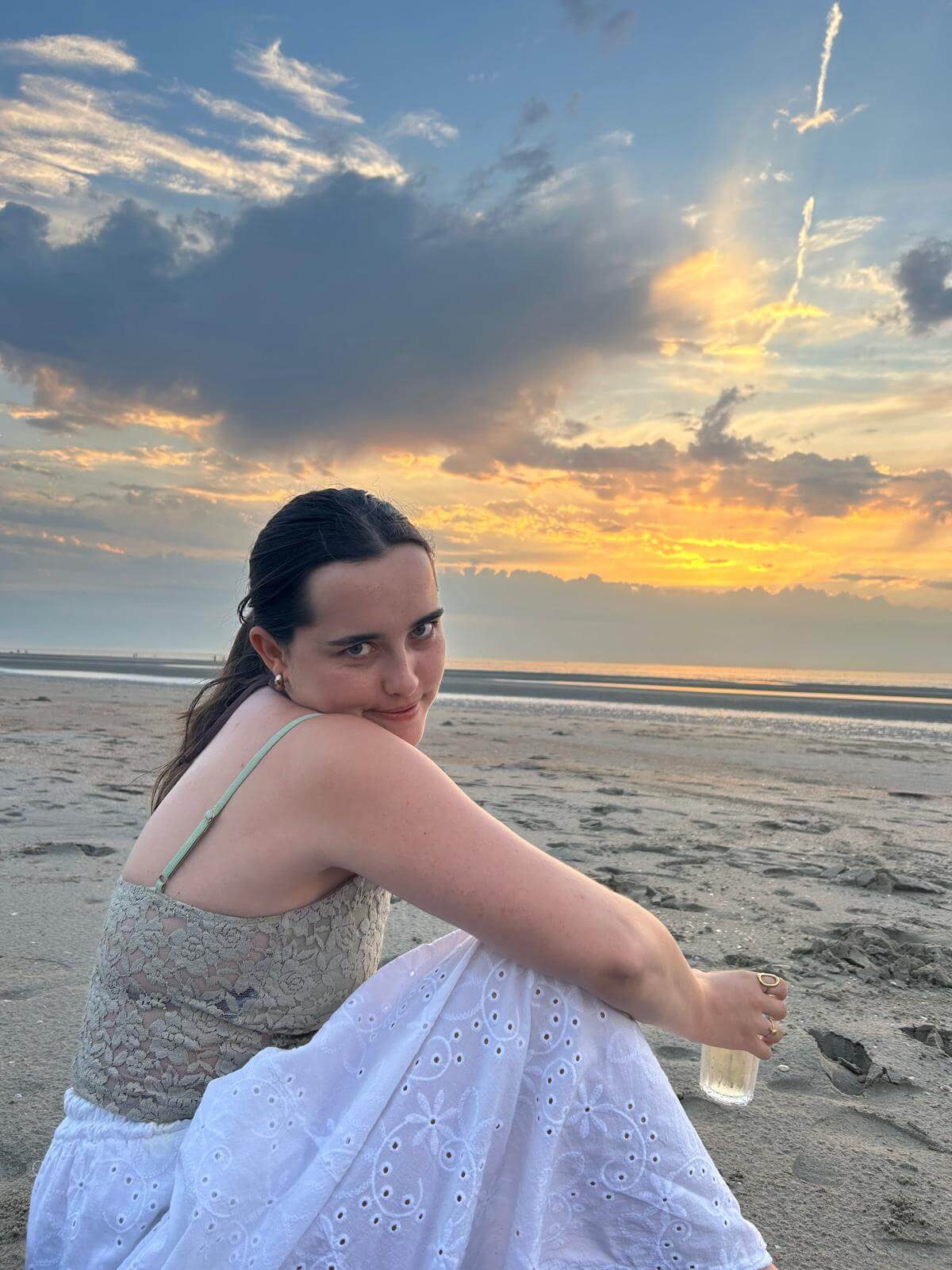 Saar watching the sunset on the beach in Oostduinkerke, Belgium
